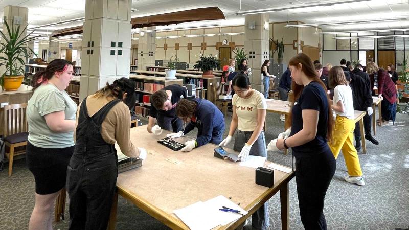 Students handling archival records 