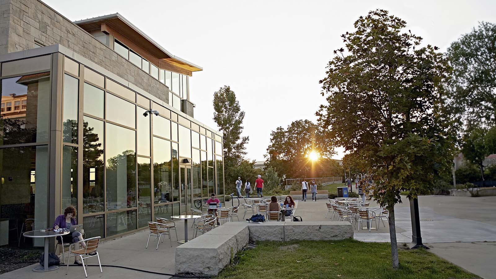 Students outside of Warch as sun sets