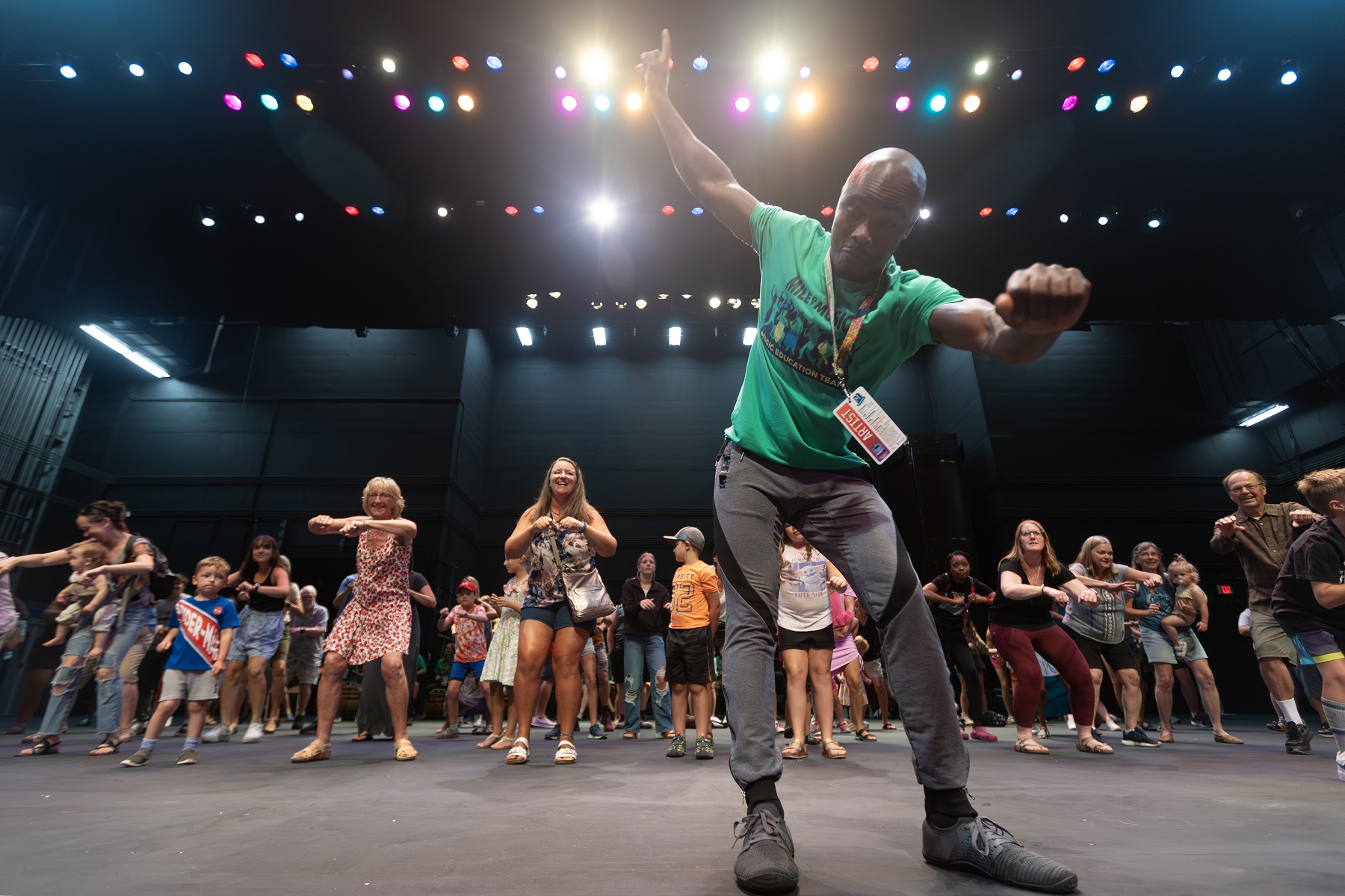 Dance instruction takes place on the stage of the Fox Cities Performing Arts Center during the 2023 Mile of Music festival.