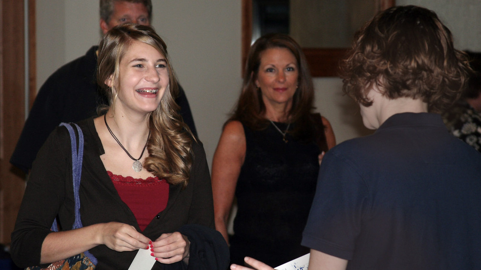 Student and there parents meet with an admissions counselor for a campus visit