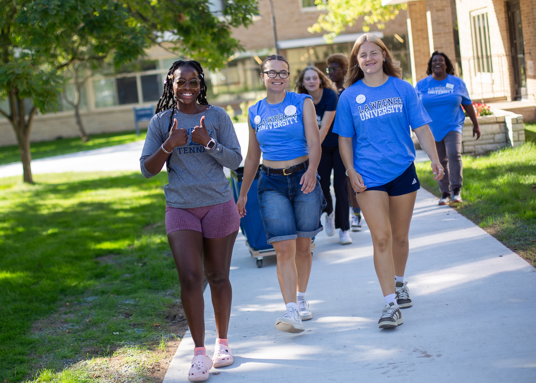 New students get an assist from returning students as they moved into residence halls on Monday.