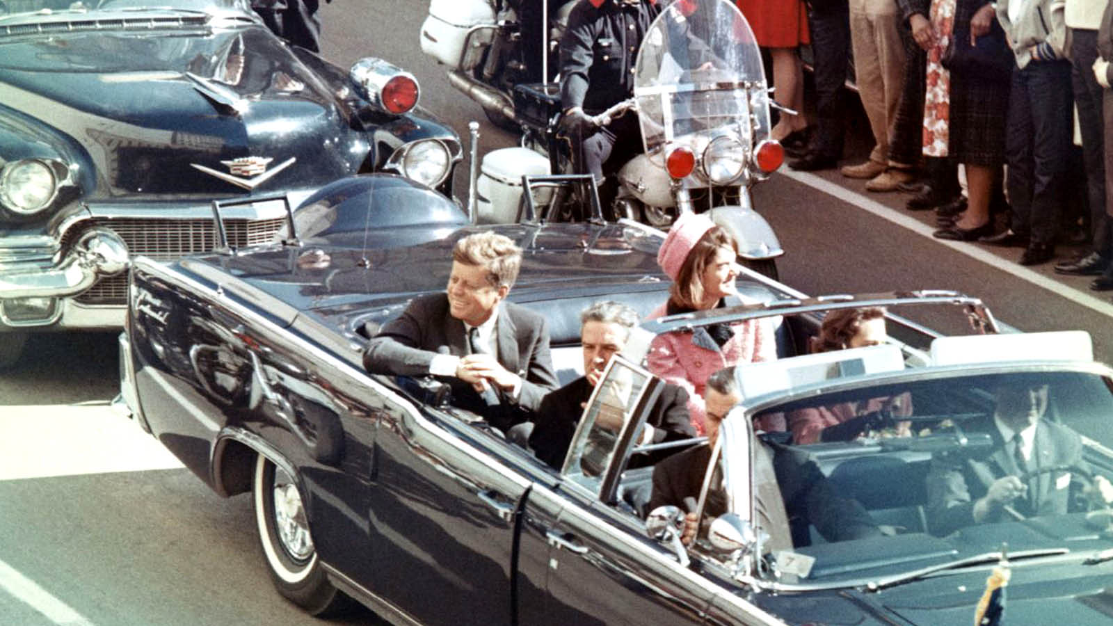 President John Kennedy and wife Jackie in presidential limousine