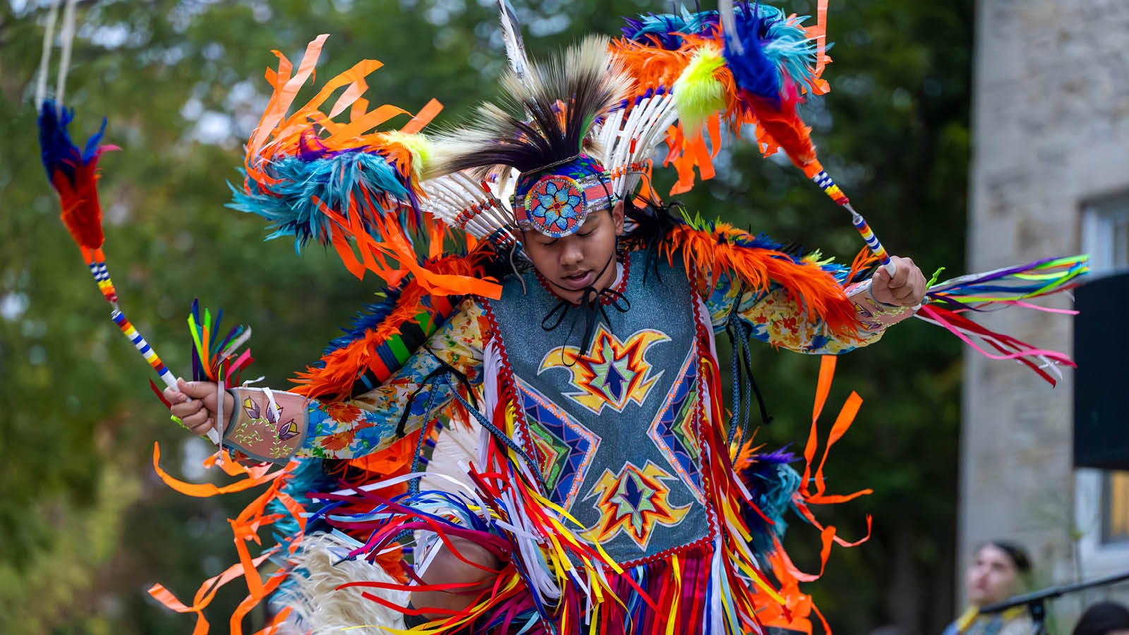 Native American dancing in traditional clothing