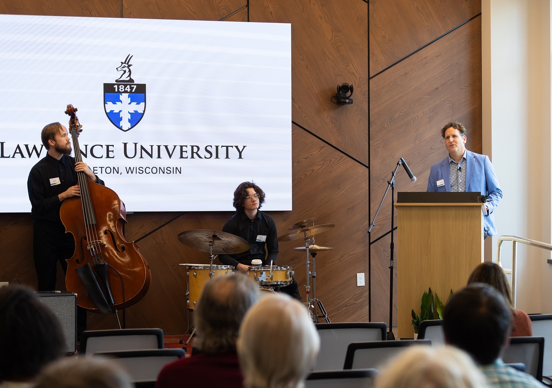 Professor Adam Galambos speaks to the audience gathered for the opening of the Business & Entrepreneurship Center.