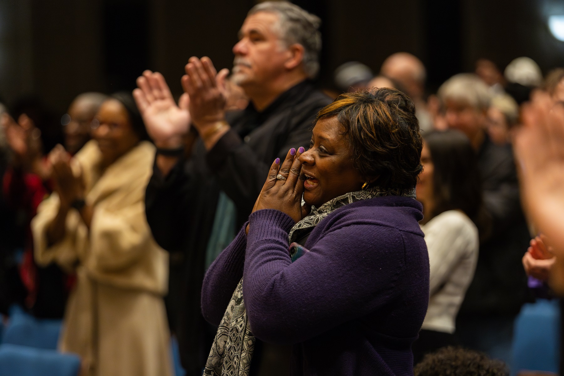 The audience claps and sings along during the MLK Celebration.