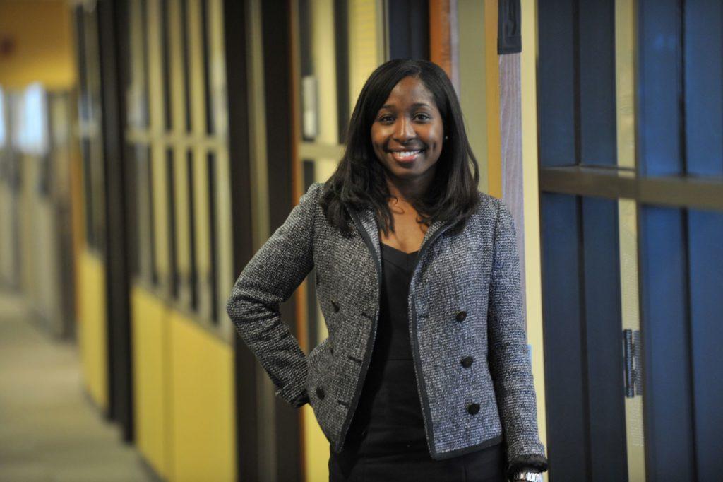 Andrea Lewis Hartung ’05 standing in a hallway