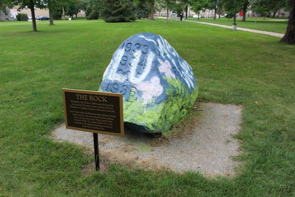 The rock painted with LU and flowers