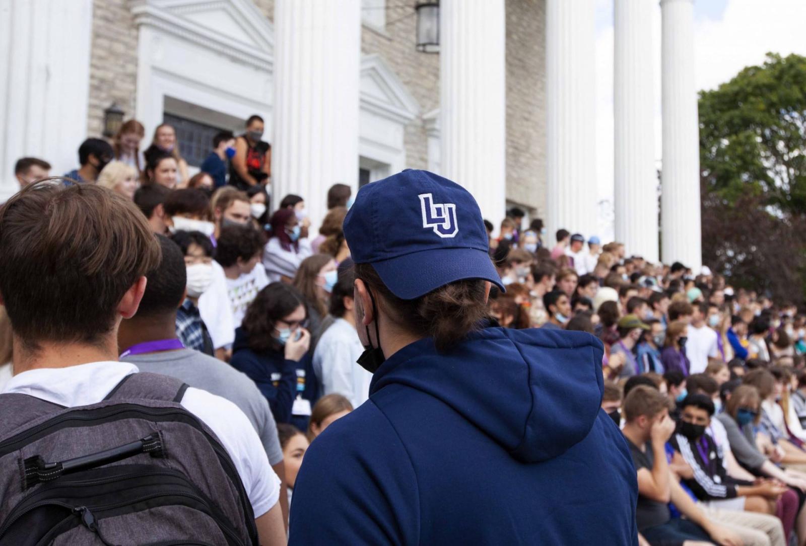 Students walking up Memorial Chapel steps for the Class of 2025 class photo.