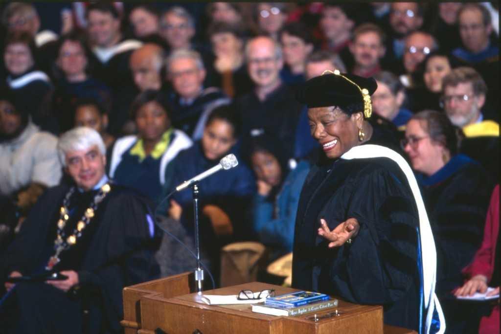 Maya Angelou gestures as she speaks from the podium during a 1997 convocation.