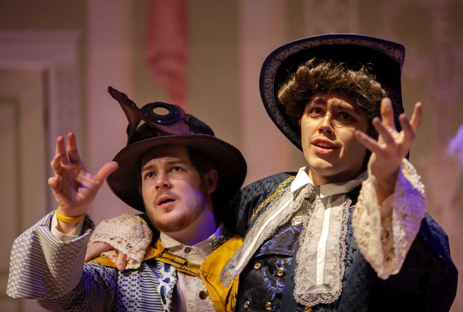 Alec Welhouse, a junior, and Jon Winkler, a sophomore, rehearse in full costume.