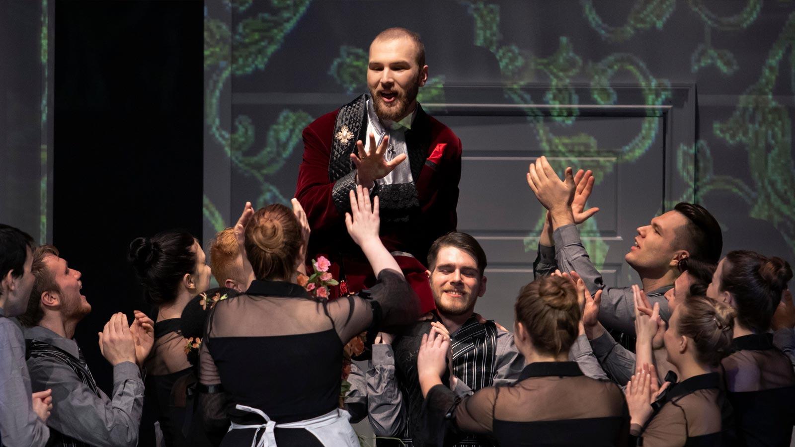 Students singing during opera performance