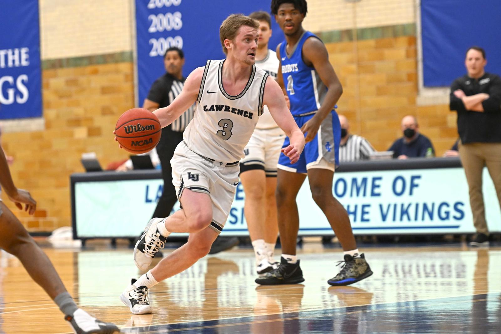 Brad Sendell dribbles to the basket in a game at Alexander Gym.