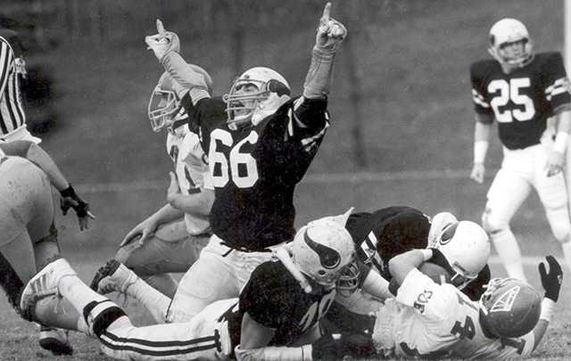 Dan Galante celebrates a defensive stop during a Lawrence football game.