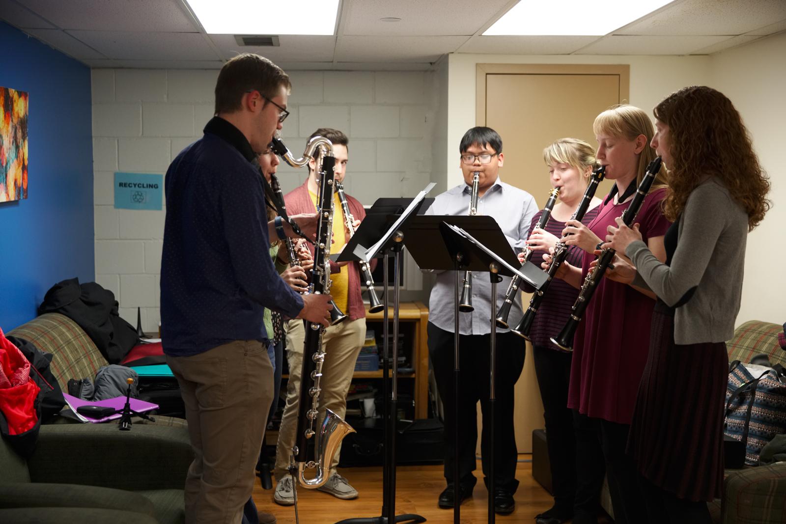 Students perform wind instruments.