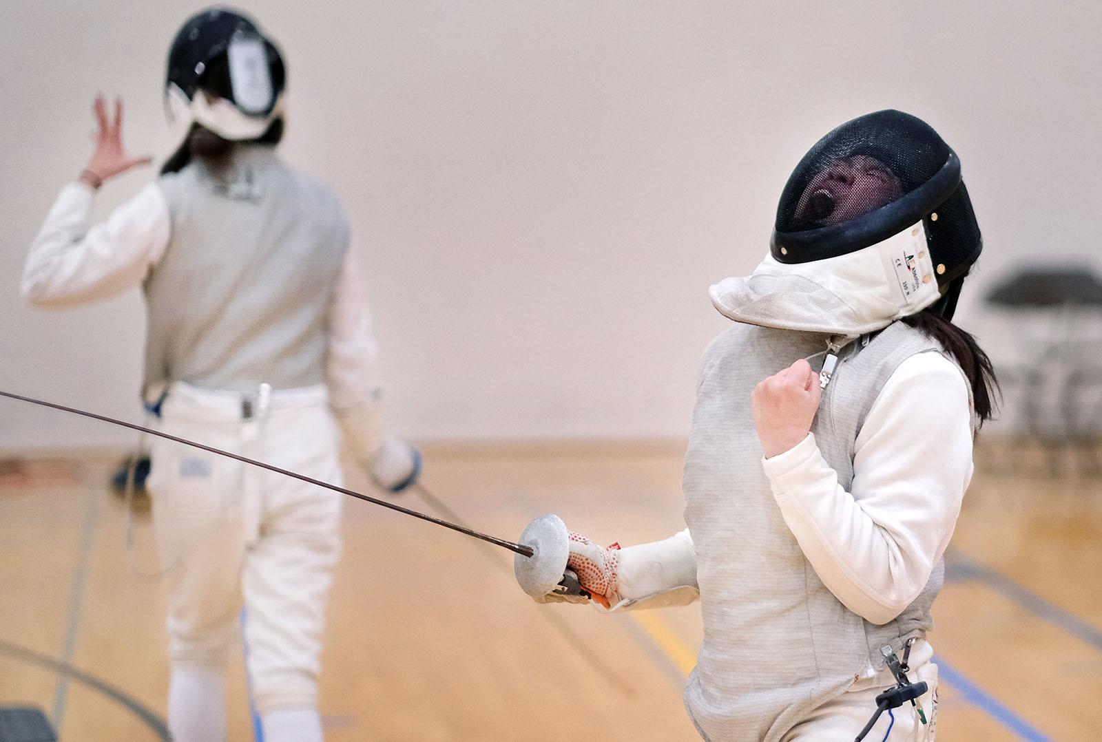 Sophia Kelley celebrates after scoring a touch during the Lawrence Duals during a November fencing match in the Wellness Center. 