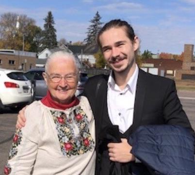 Mary Deckert shares a moment with Bohdan Tataryn. She's wearing a traditional Ukrainian blouse. 