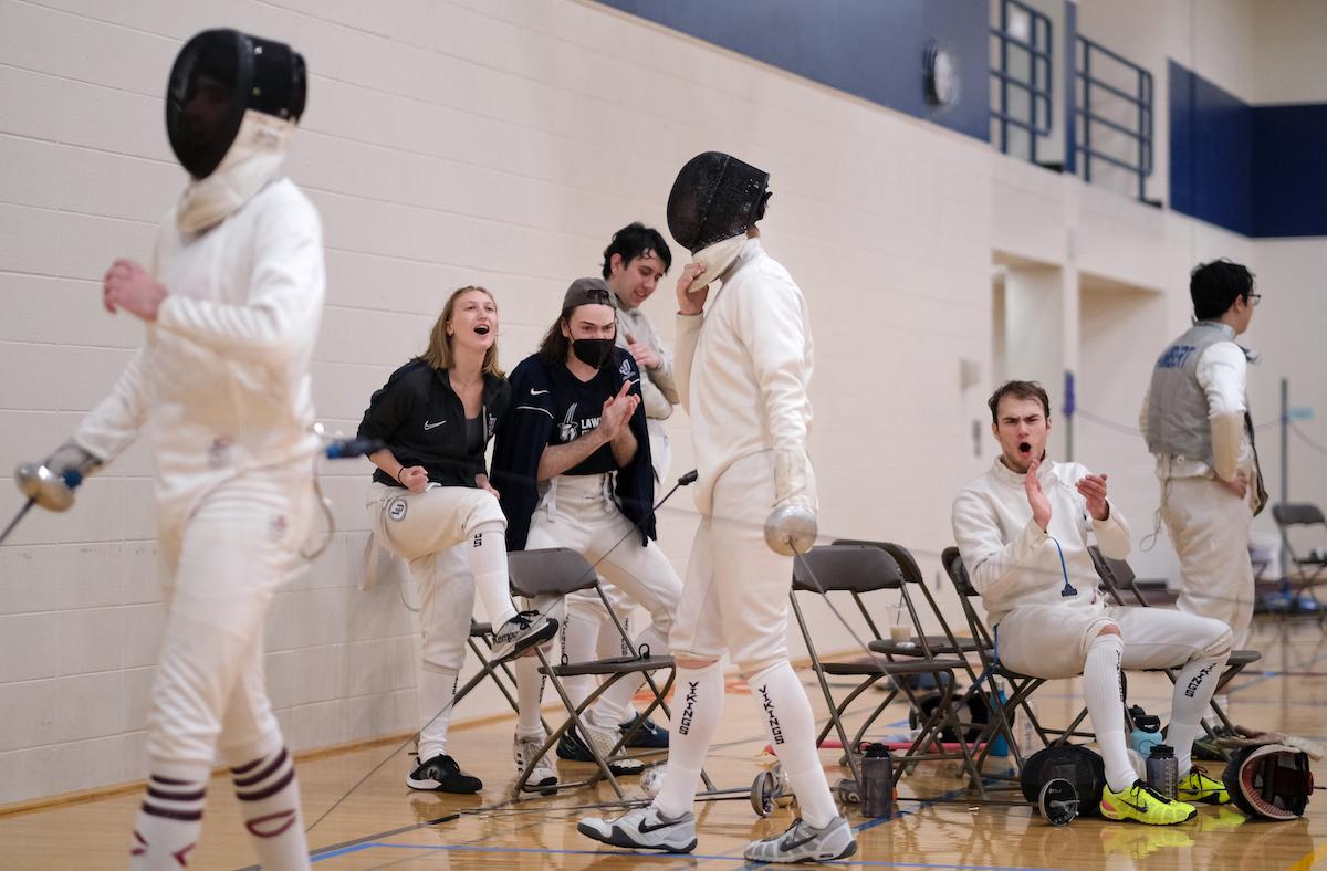 Teammates show support during a tournament in the Wellness Center.