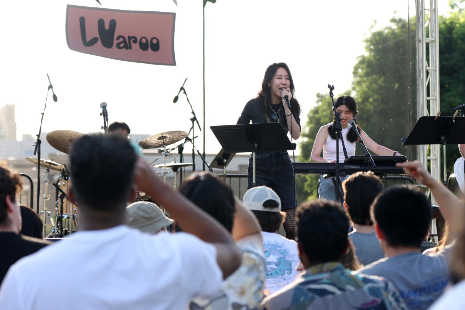 Fusion draws a big crowd in front of the stage during their performance.