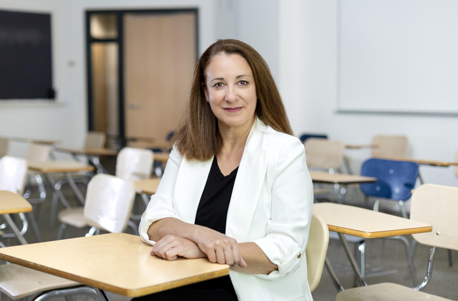 Rosa Tapia poses for a photo in a Lawrence classroom.