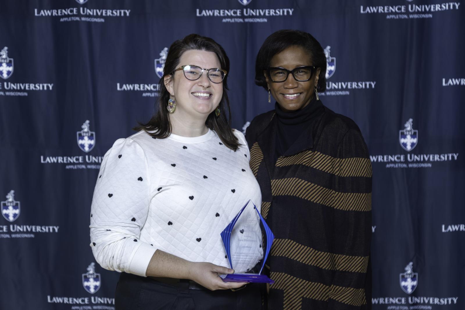 Sara Holtzman poses for a photo with President Laurie Carter.