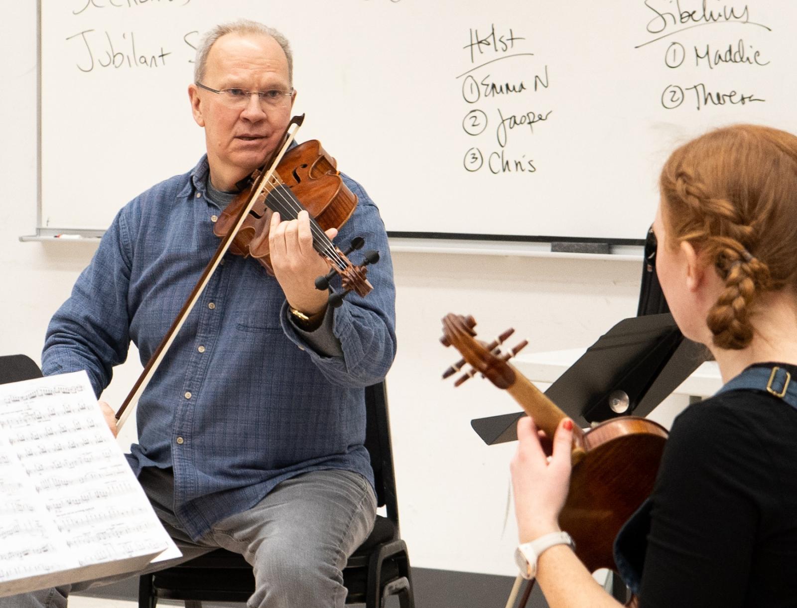 Matthew Michelic works with a student in his studio.