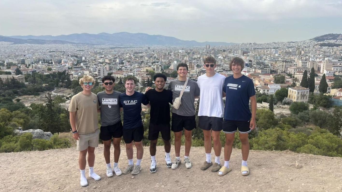Lawrence basketball players pose for a photo while in Greece.