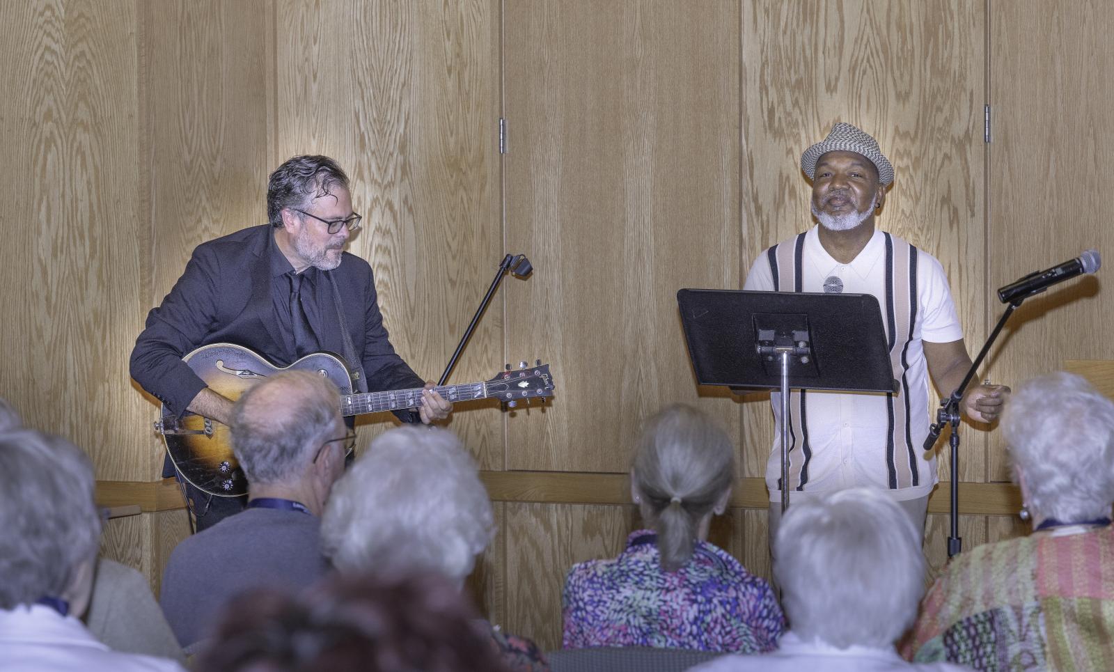 a guitarist and vocalist perform