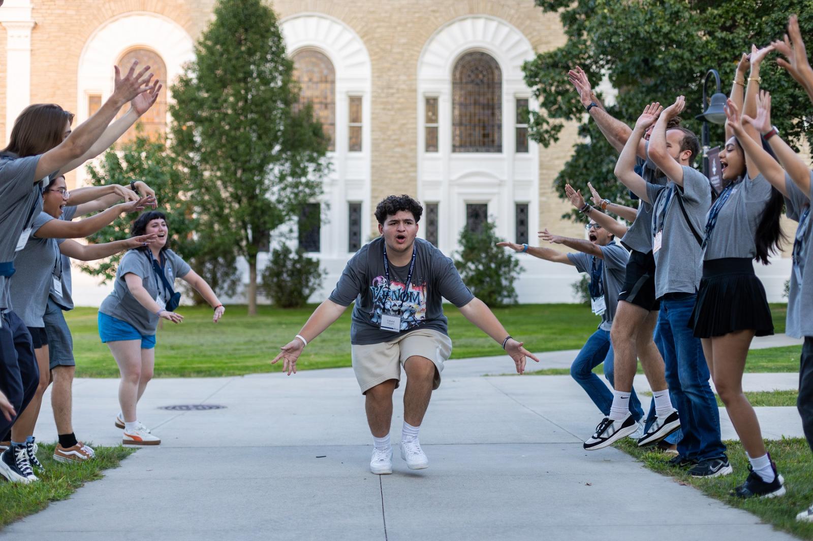 A student is celebrated at the Welcome Week Kickoff event.