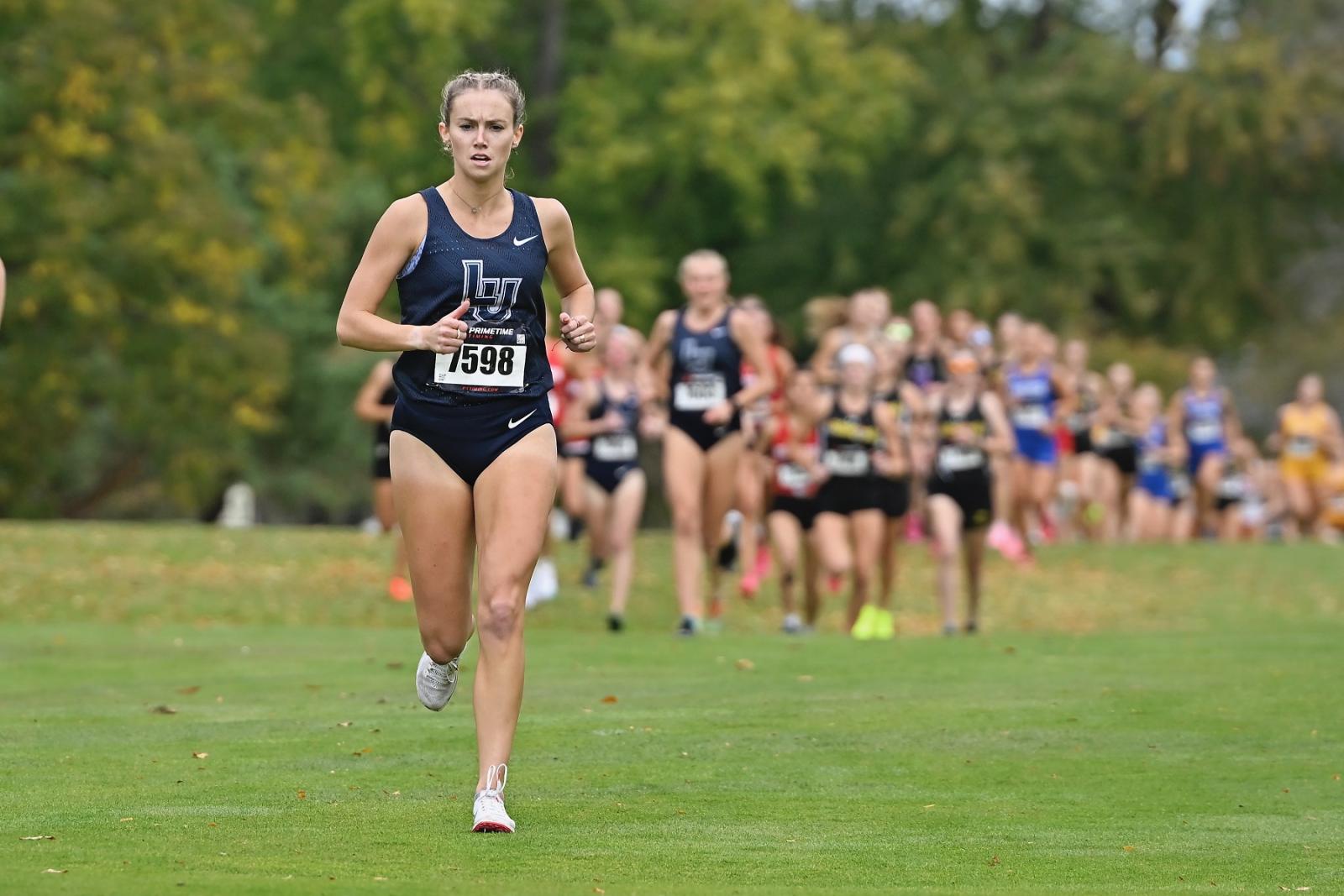 Cristyn Oliver runs ahead of the field in the Gene Davis Invitational at Reid Golf Course in Appleton.