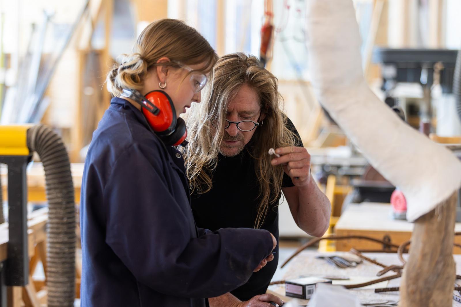 Ellie Kane, a senior studio art major, creates bike racks from scrap metal as part of summer research with Rob Neilson, Frederick R. Layton Professor of Studio Art and professor of art.