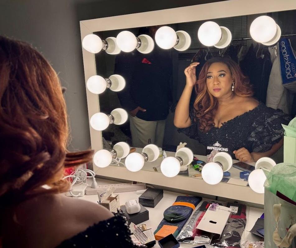 Hannah Jones preps back stage in front of a mirror. 