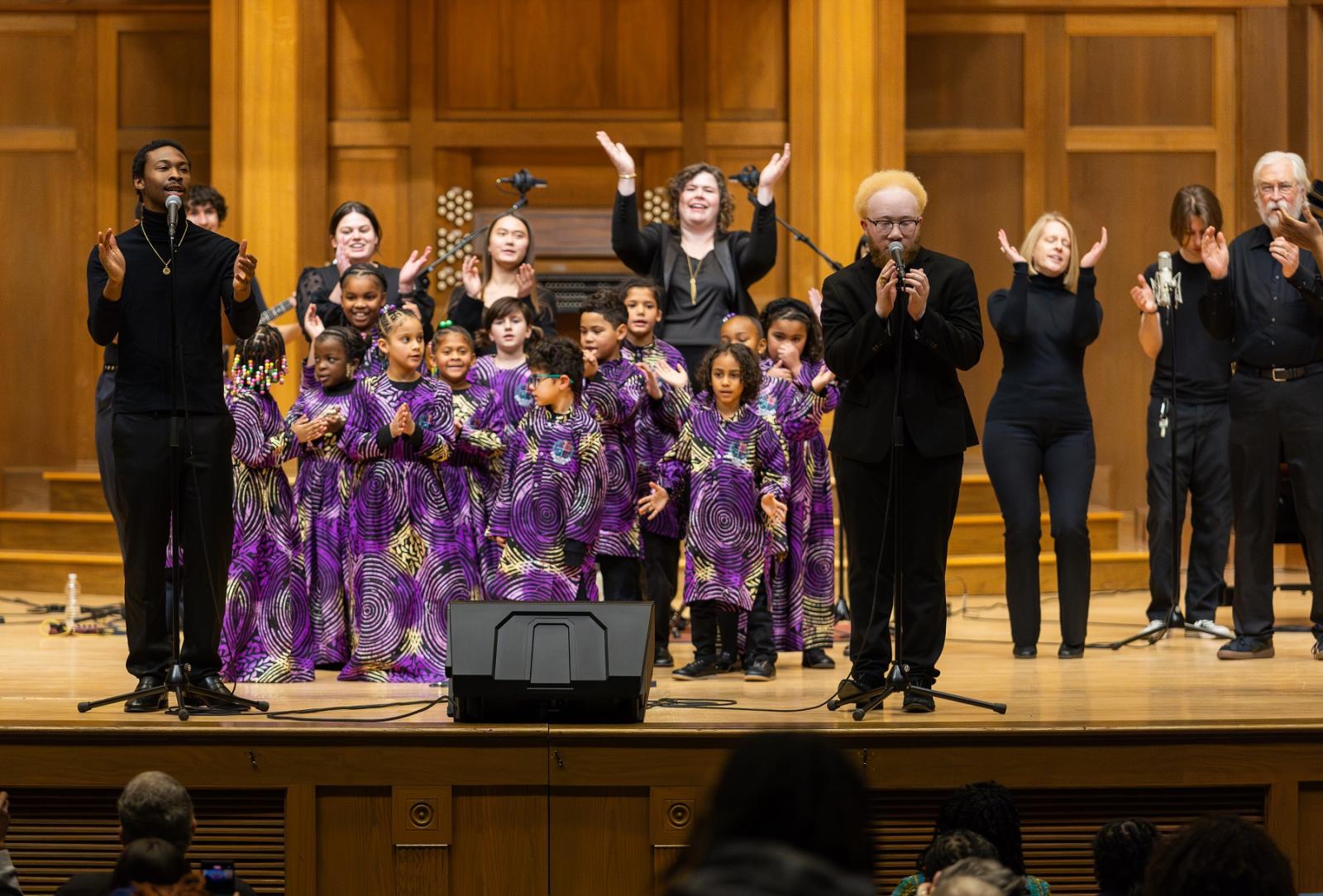 Lawrence senior Seckou Soumare (right) and Preston Parker lead a performance of "Lean on Me" at the close of the 34th Fox Cities Dr. Martin Luther King Jr. Celebration at Memorial Chapel.