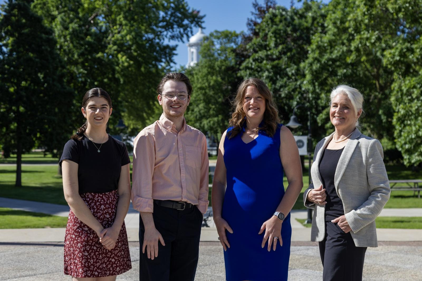 Dana Abbo '24, Ryan Saladin '24, Elizabeth Becker, and Karen Leigh-Post pose for a photo on the Lawrence campus.