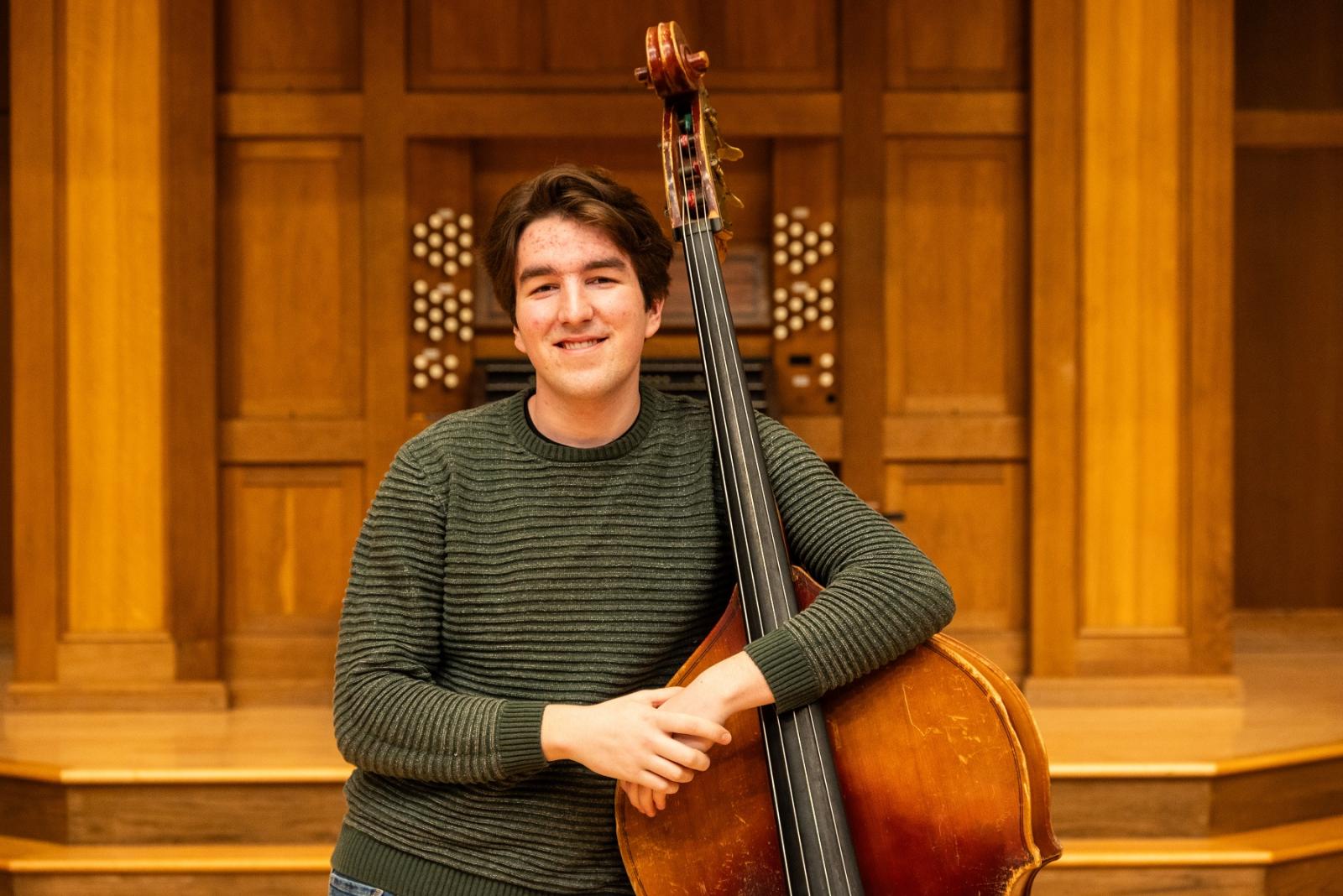 Ben Lewis poses for a photo on the Memorial Chapel stage.