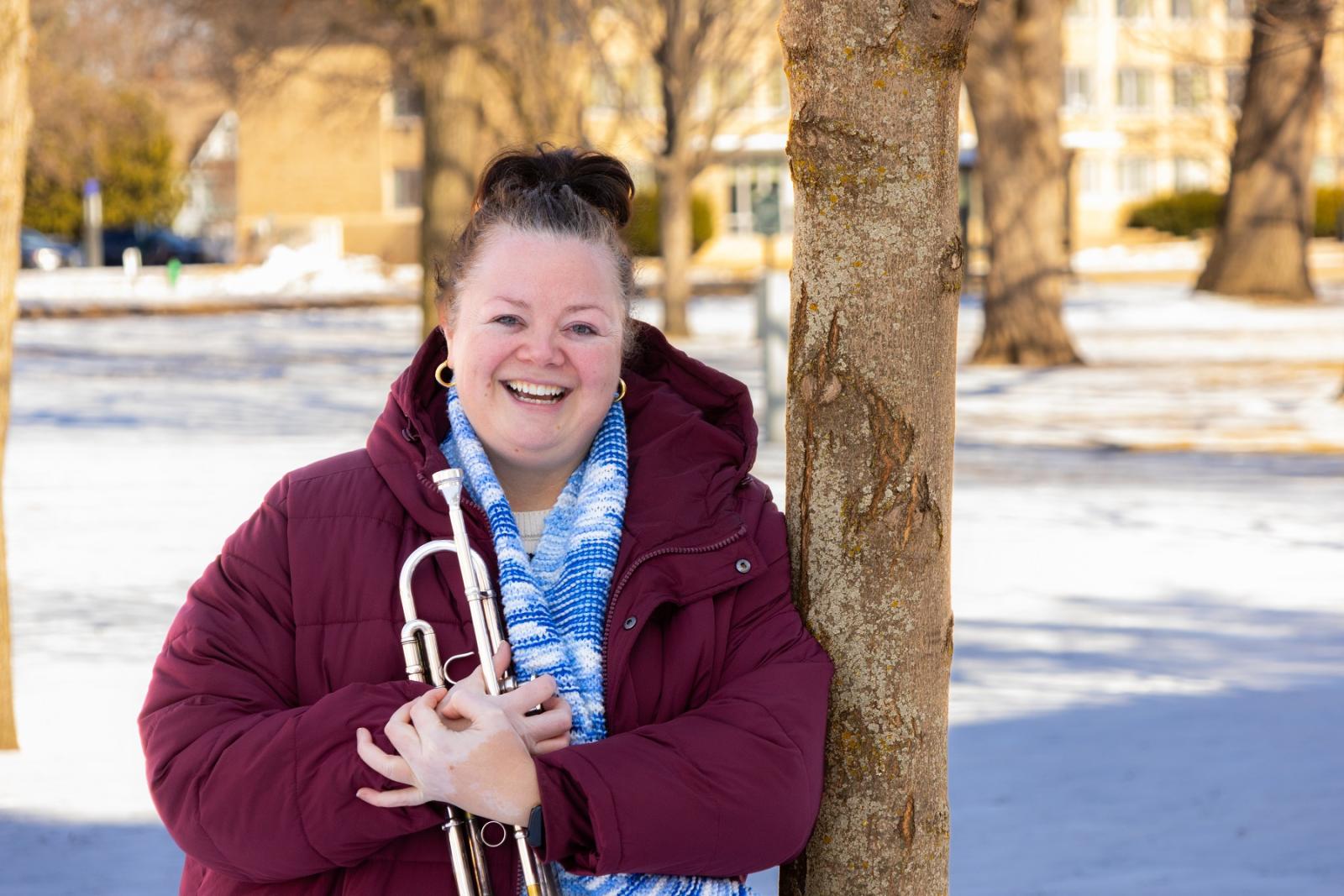 Nadje Noordhuis poses with her trumpet on Main Hall Green.