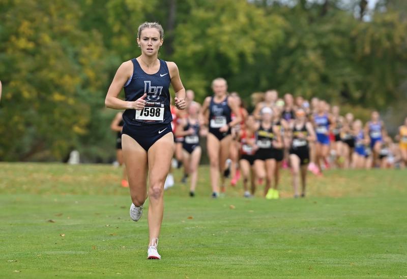 Cristyn Oliver runs ahead of the field in the Gene Davis Invitational at Reid Golf Course in Appleton.