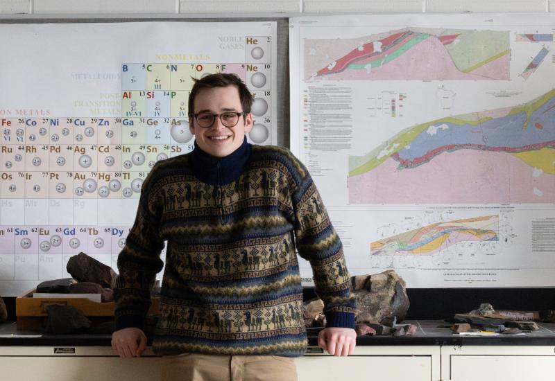 Zachary Hogan poses for a photo in a science lab at Lawrence University.