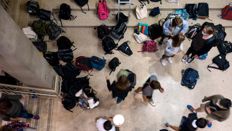 Students drop off and pick up their bags outside of Andrew Commons 