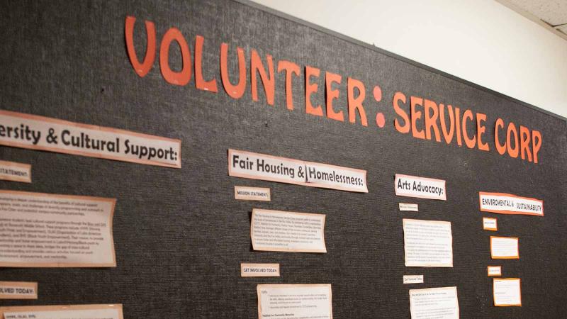 Image of a bulletin board with the words Volunteer: Service Corp and information about volunteering