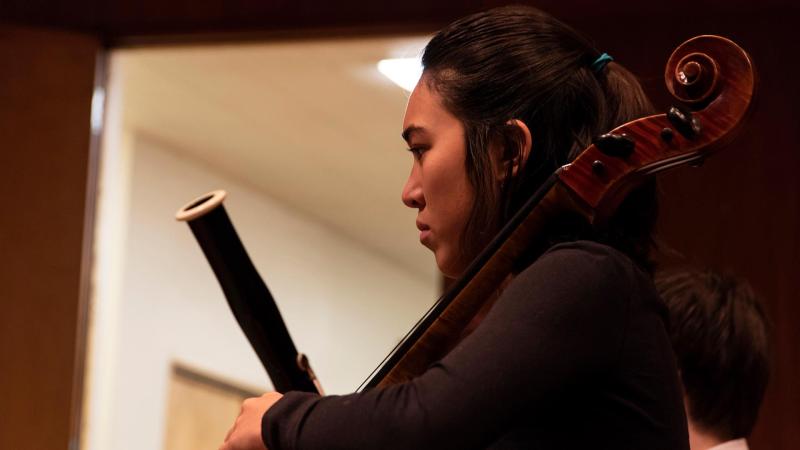 Lawrence Community School students plays cello at recital