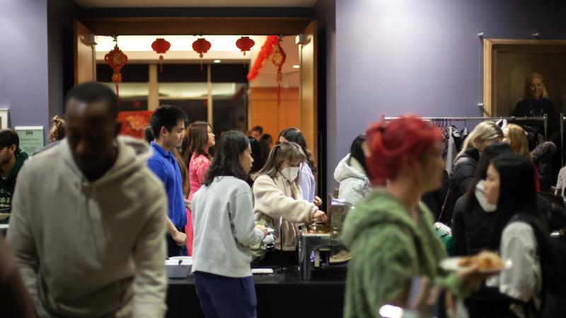 Participants in the celebration of Lunar New Year share a meal in the Warch Campus Center.