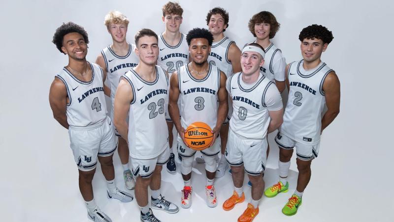 Men's basketball team poses for a team photo