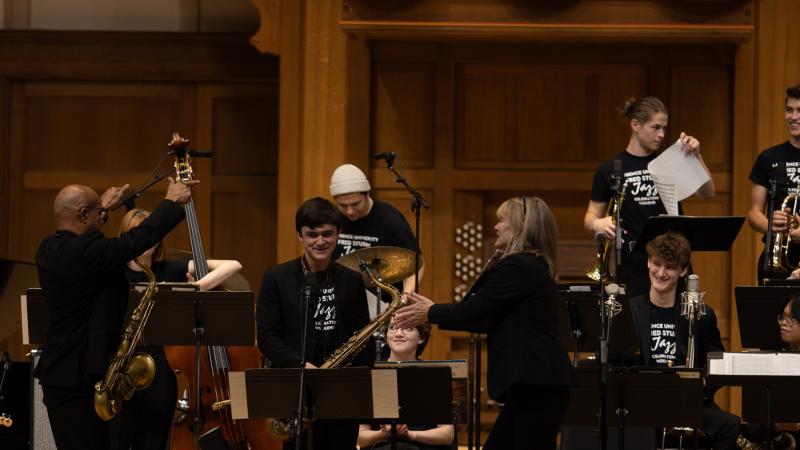 Patty Darling and Jose Encarnacion lead students in a performance in Memorial Chapel during the 2023 Jazz Celebration Weekend.