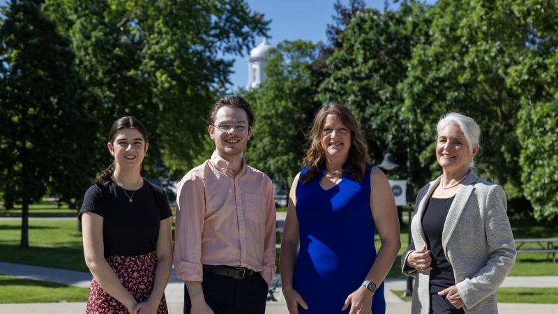 Dana Abbo '24, Ryan Saladin '24, Elizabeth Becker, and Karen Leigh-Post pose for a photo on the Lawrence campus.