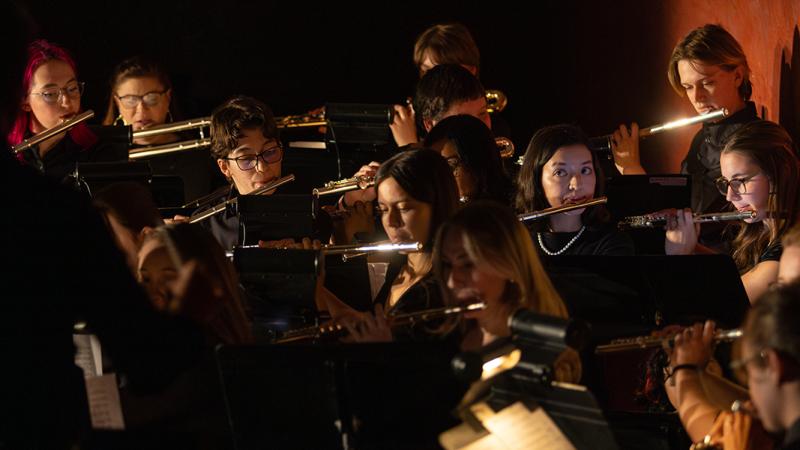 An ensemble of musicians playing flutes.