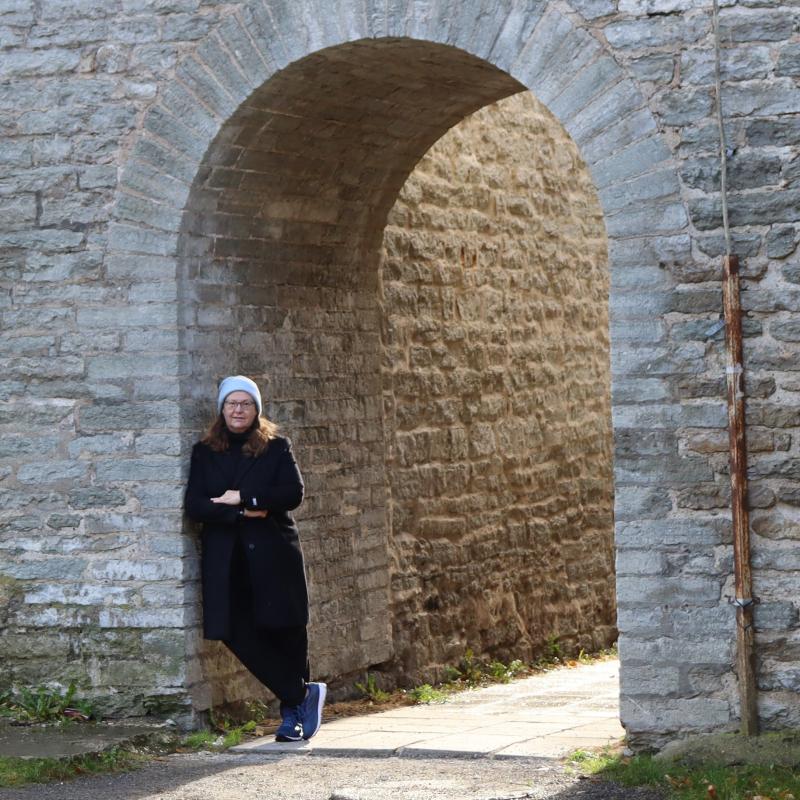 Prof. Claudena Skran at the medieval wall in the Old Town of Tallinn, Estonia.