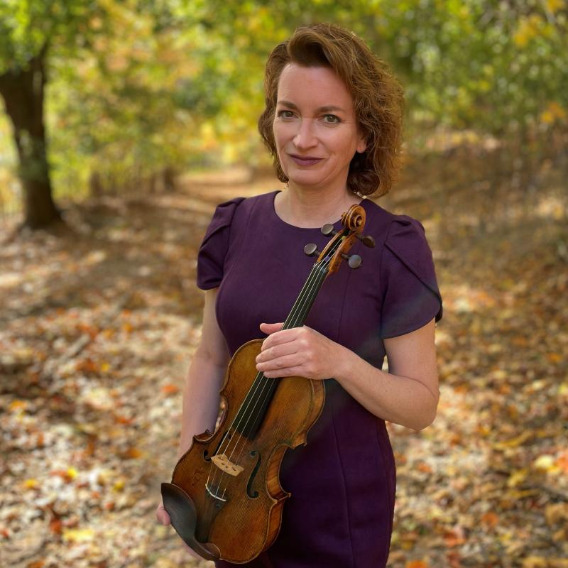 Samantha George holding violin