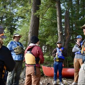 Student and leaders discussing the planned canoe excursion - 2024 Land and Sea Pre-orientation Experience